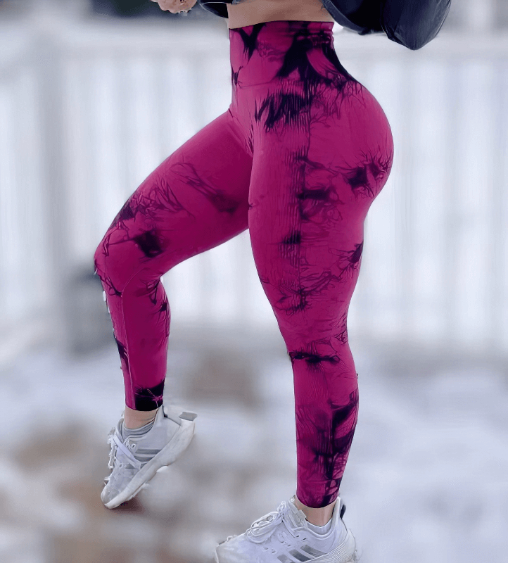 Seamless tight women's leggings with push-up effect in vibrant pink, featuring high waist, ankle-length, and booty-lifting style.